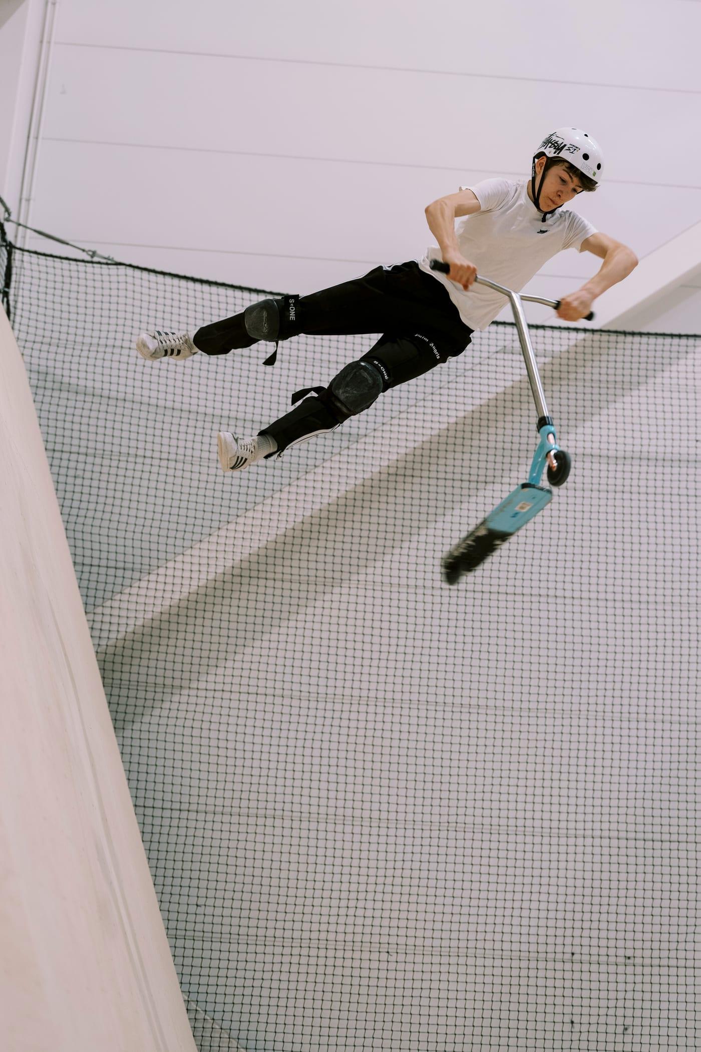 Scooter at speed over a jump